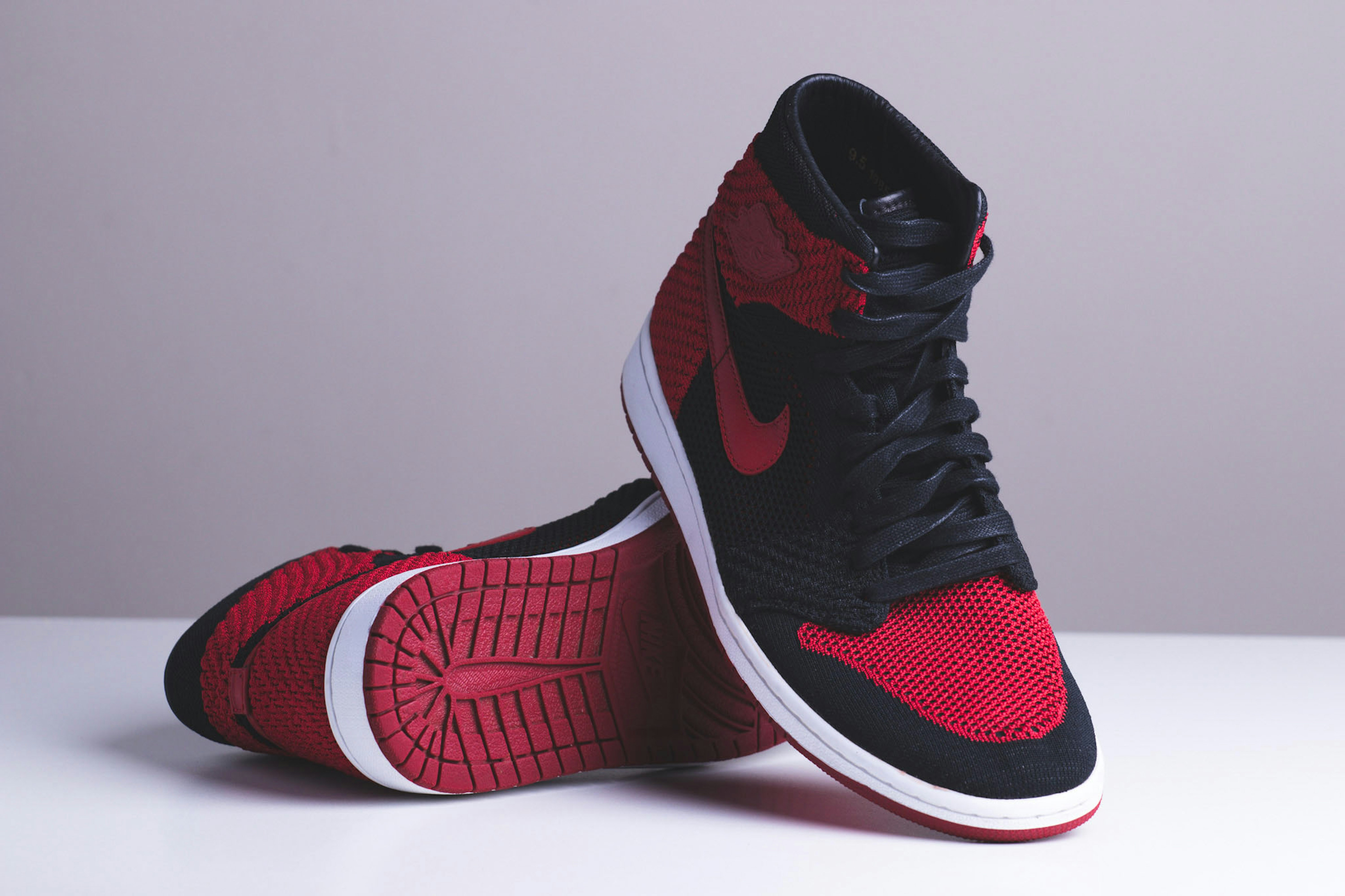 red and black high top nikes