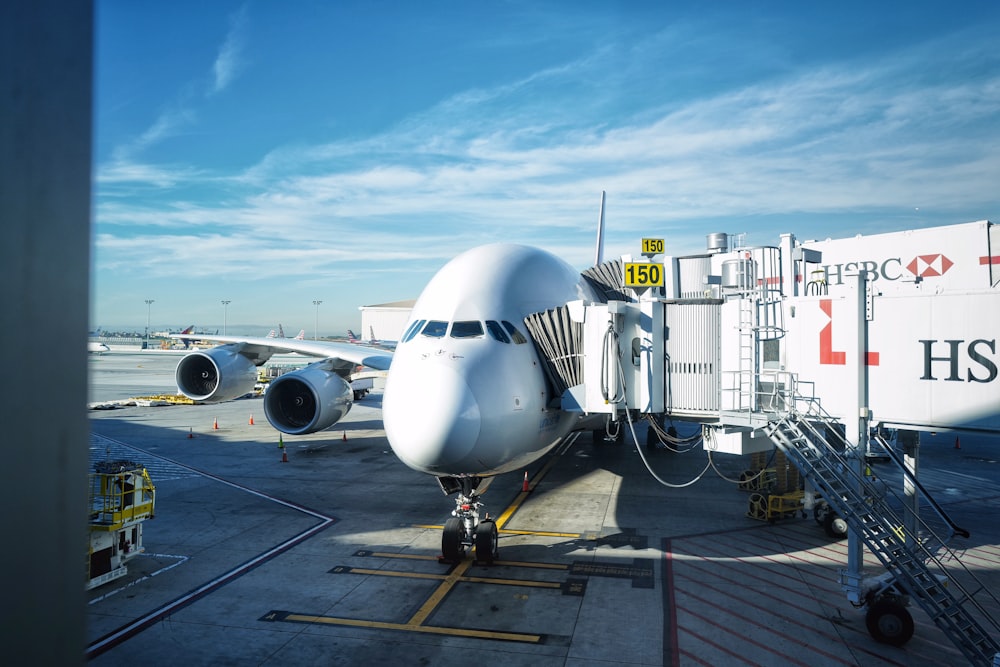 white airplane on airport during daytime