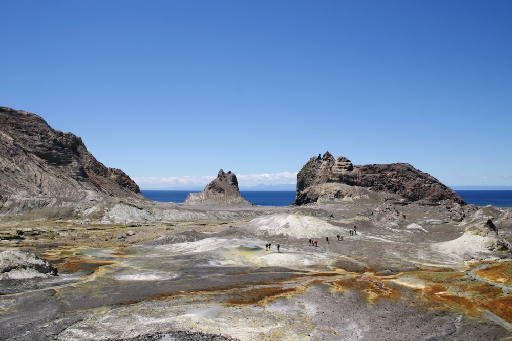 brown rock formation on sea shore during daytime