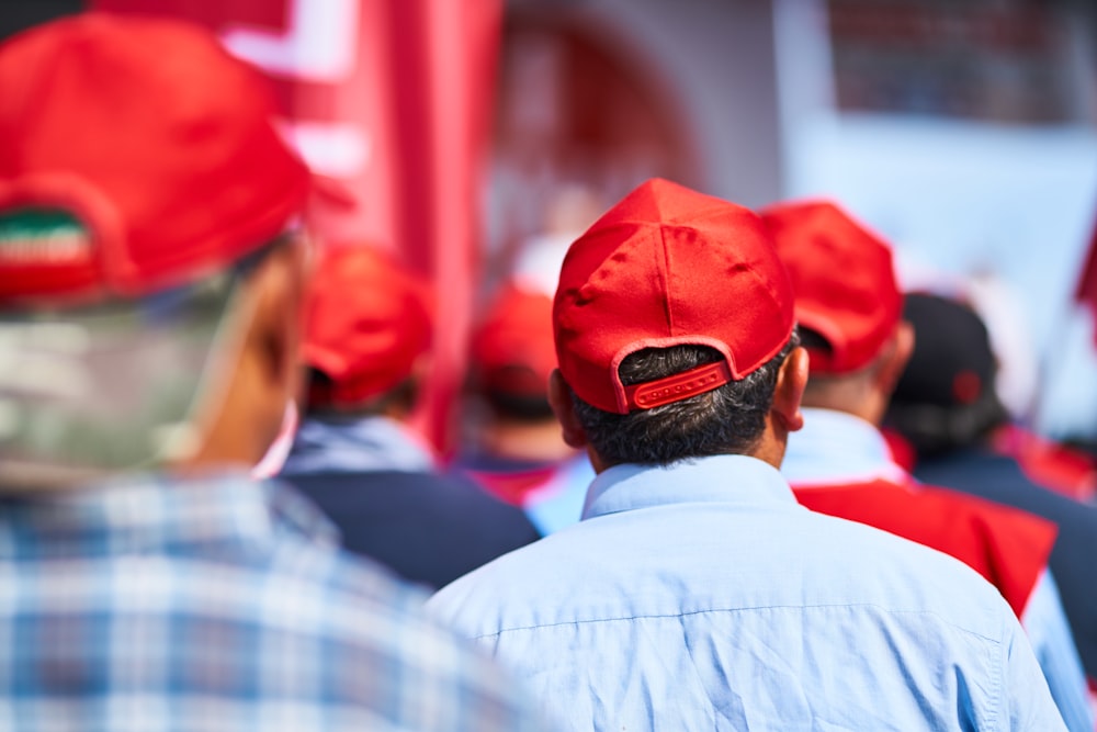 man in red knit cap and white shirt