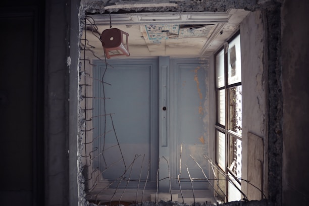 white wooden door with brown steel door