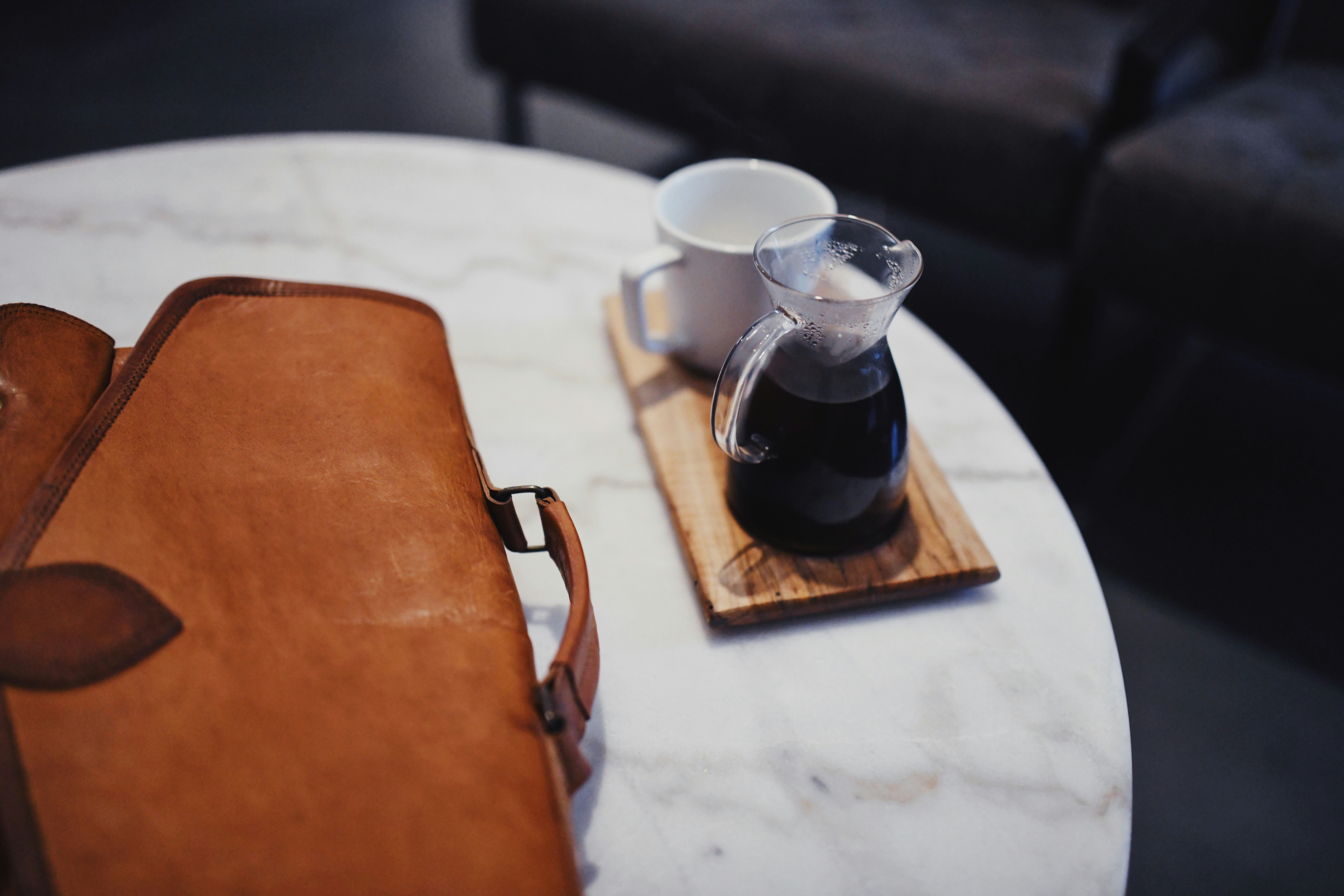clear glass pitcher on white table