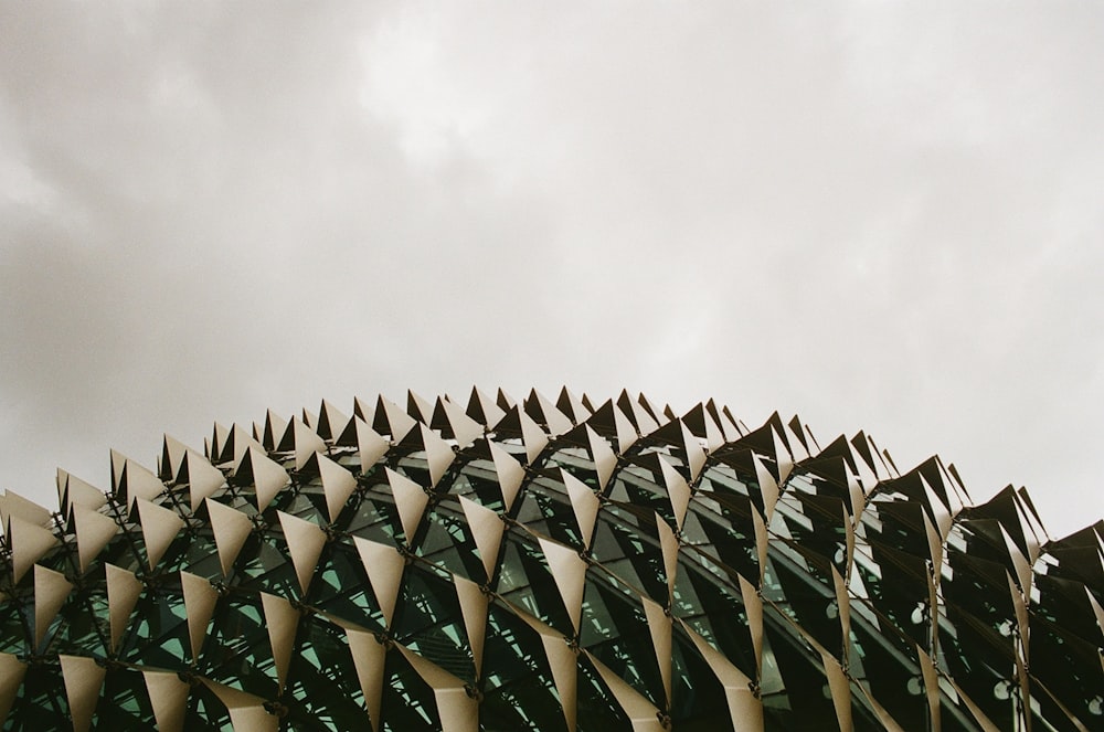 low angle photography of gray metal building