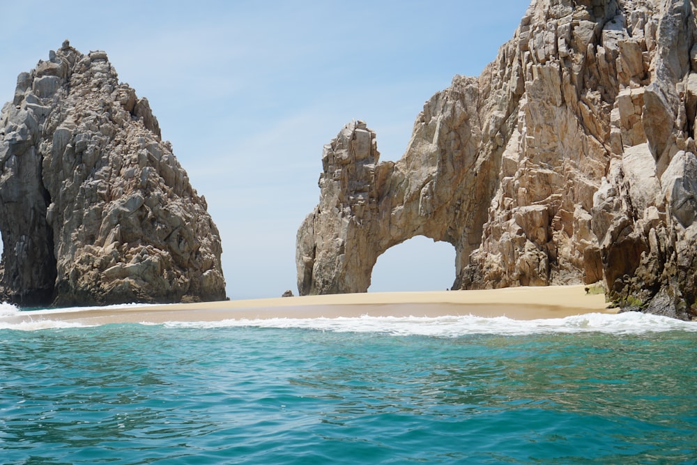 brown rock formation on sea during daytime