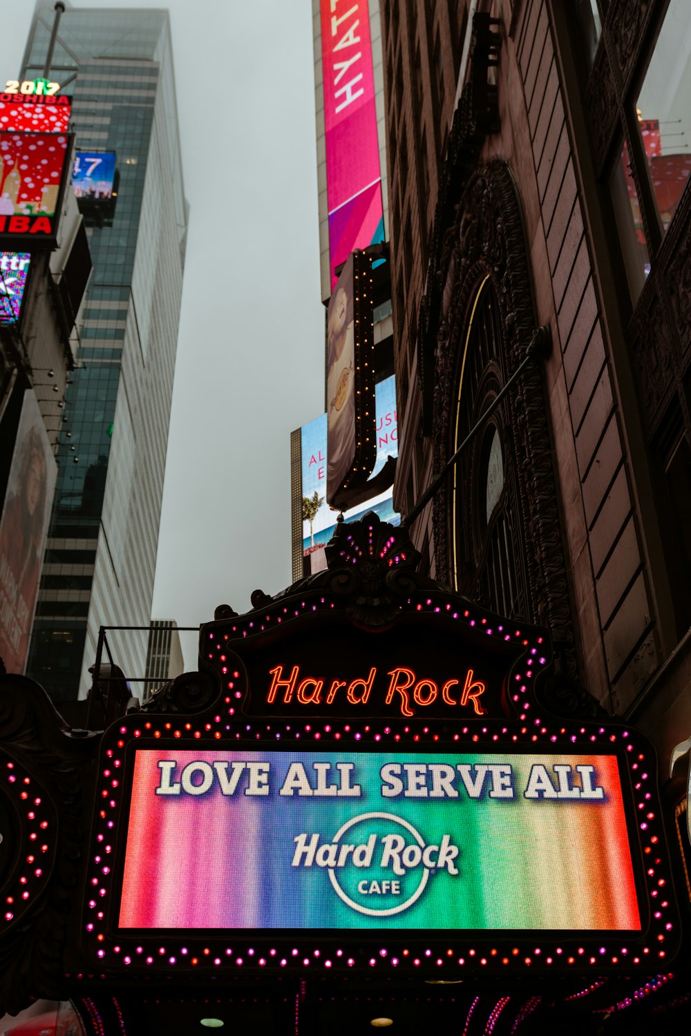 a neon sign on the side of a building