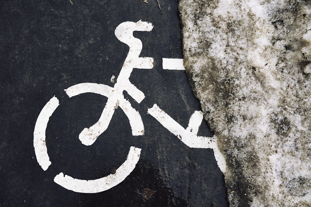 a bicycle lane painted with white paint on a sidewalk