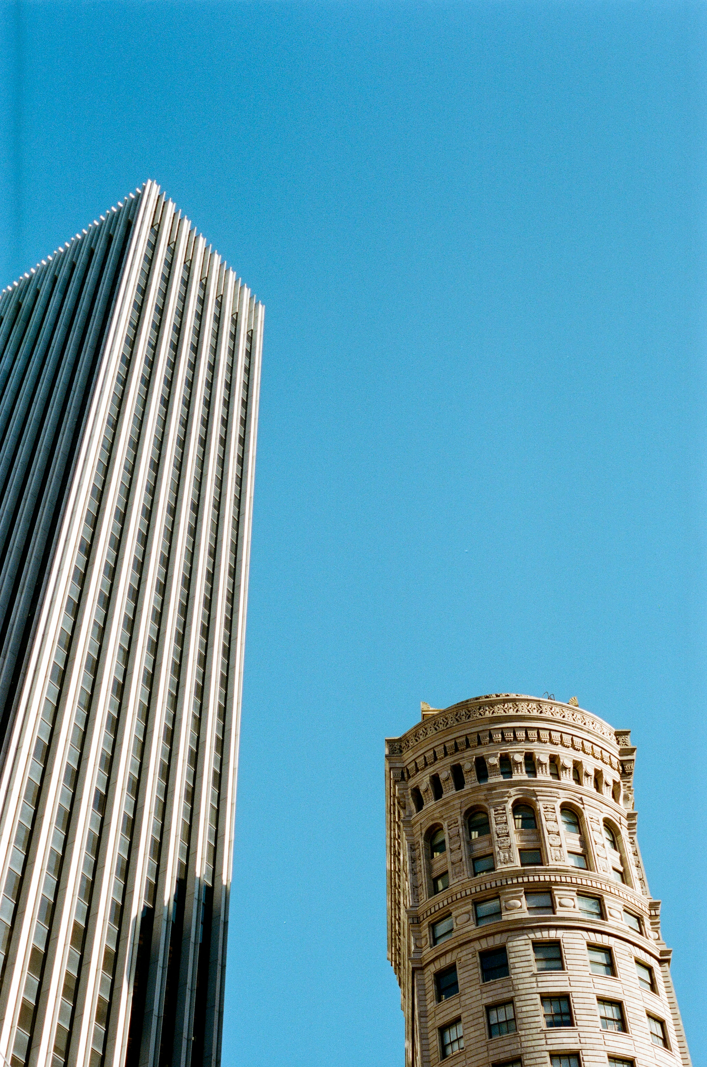 white and blue concrete building under blue sky during daytime