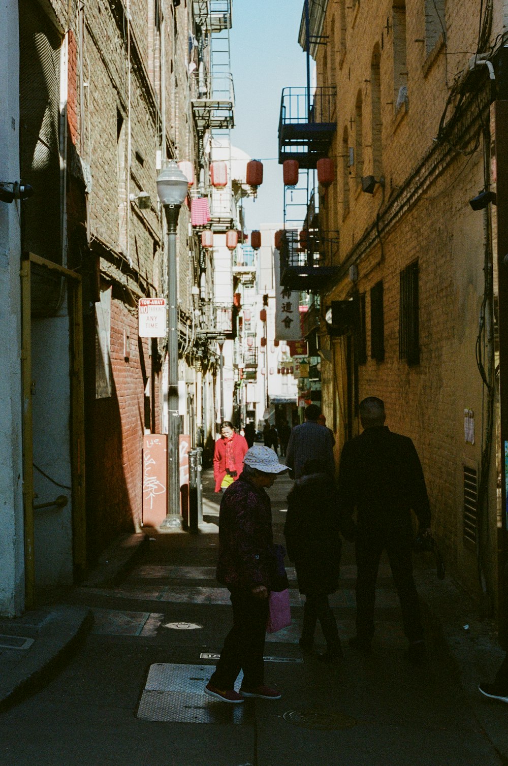 people walking on sidewalk during daytime