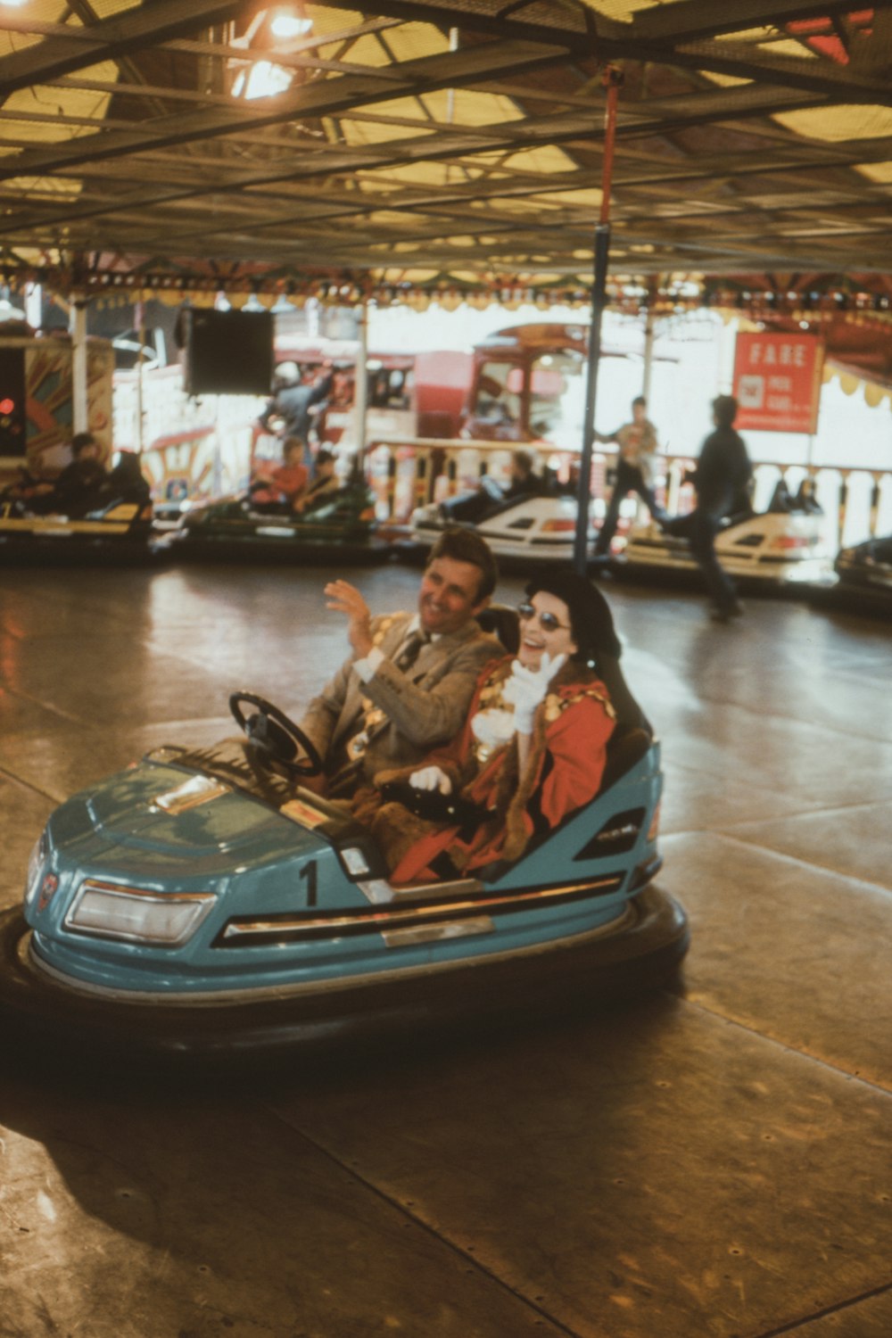 woman in white shirt riding blue convertible car