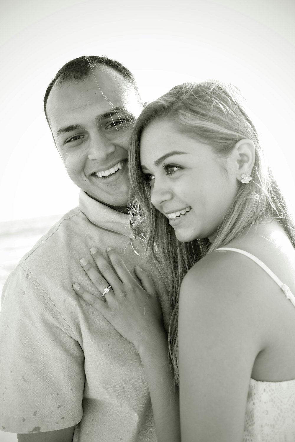 grayscale photo of woman and man smiling