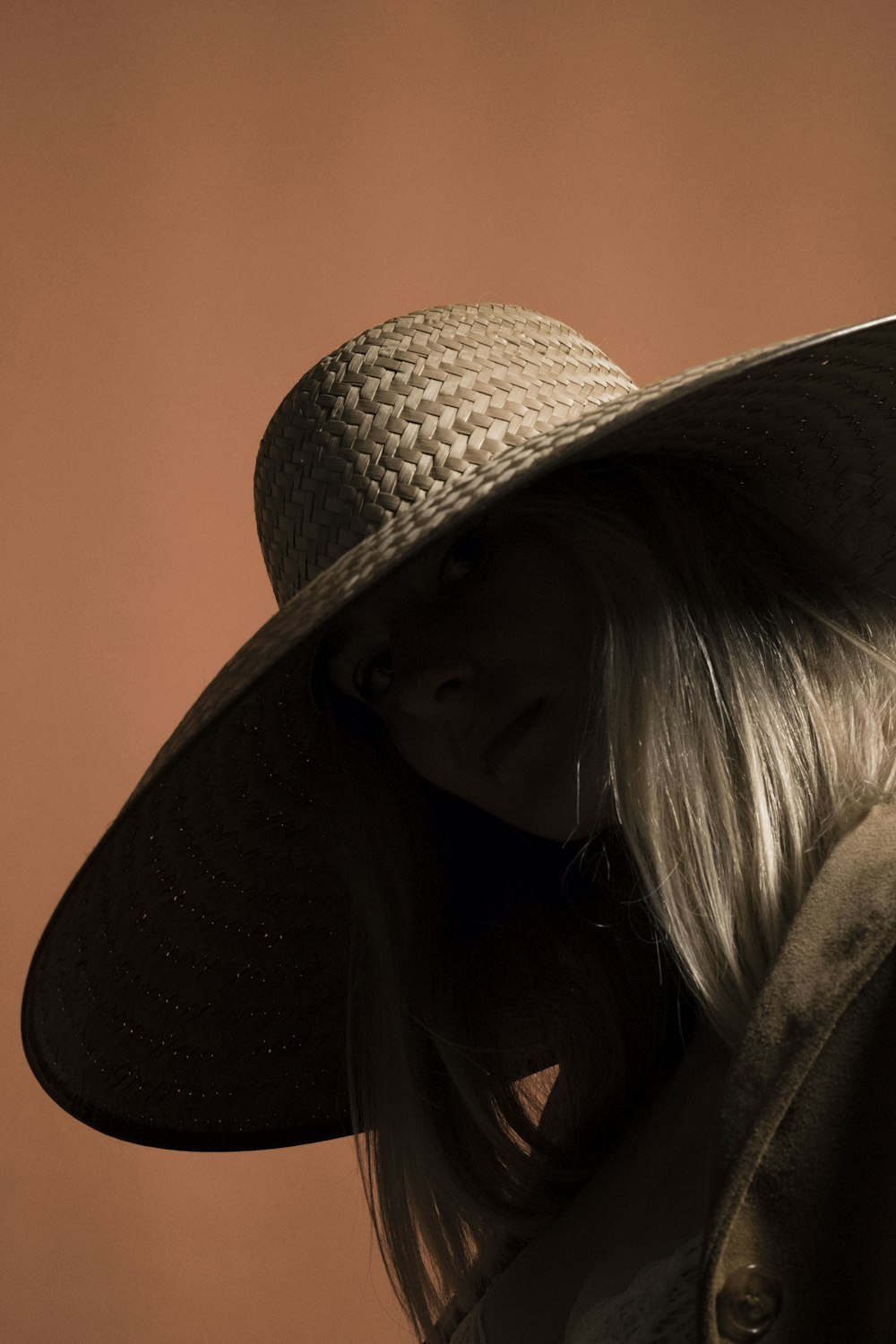 woman in black and white hat