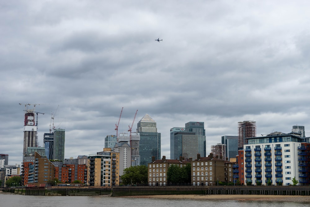 high rise buildings under white clouds during daytime