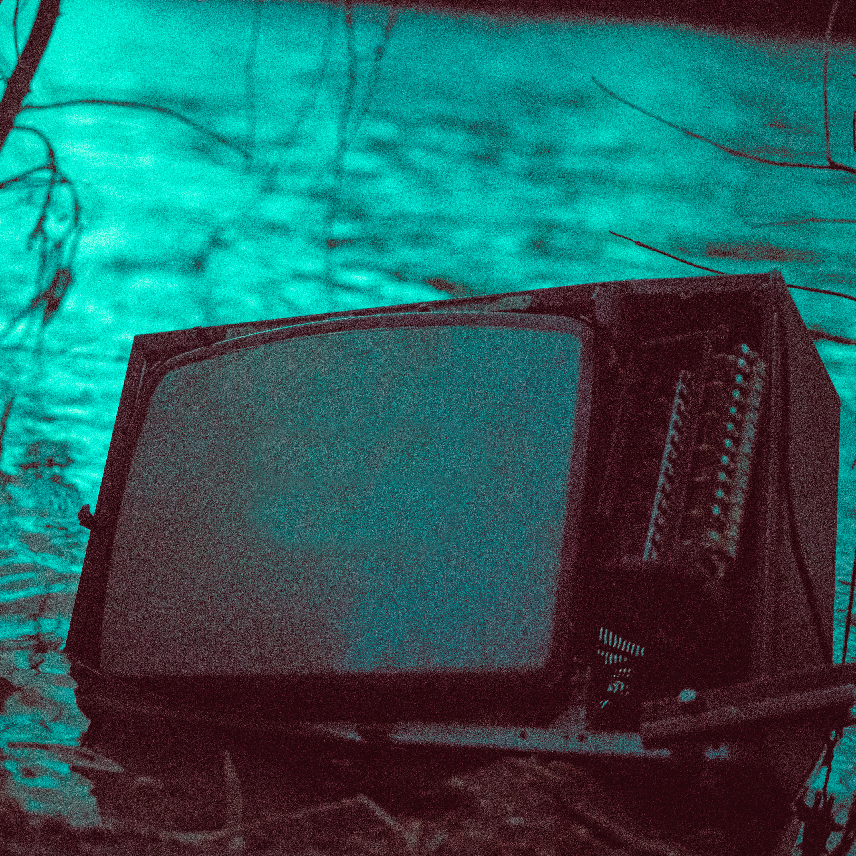 black crt tv on snow covered ground