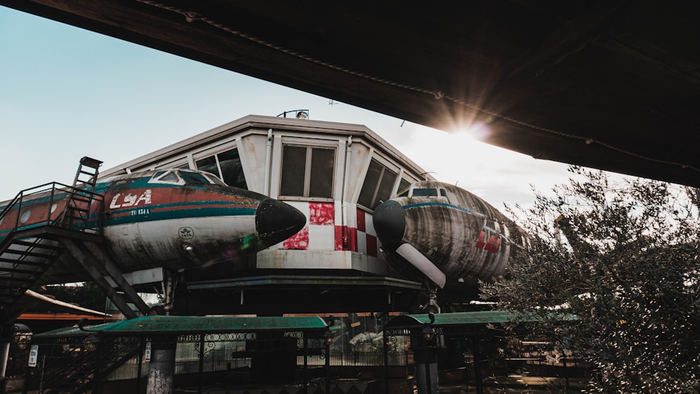 red and white airplane on the ground