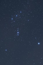 An artistic depiction of Libra constellation shining brightly in a night sky.