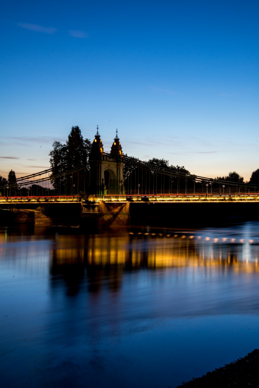 bridge over water during night time