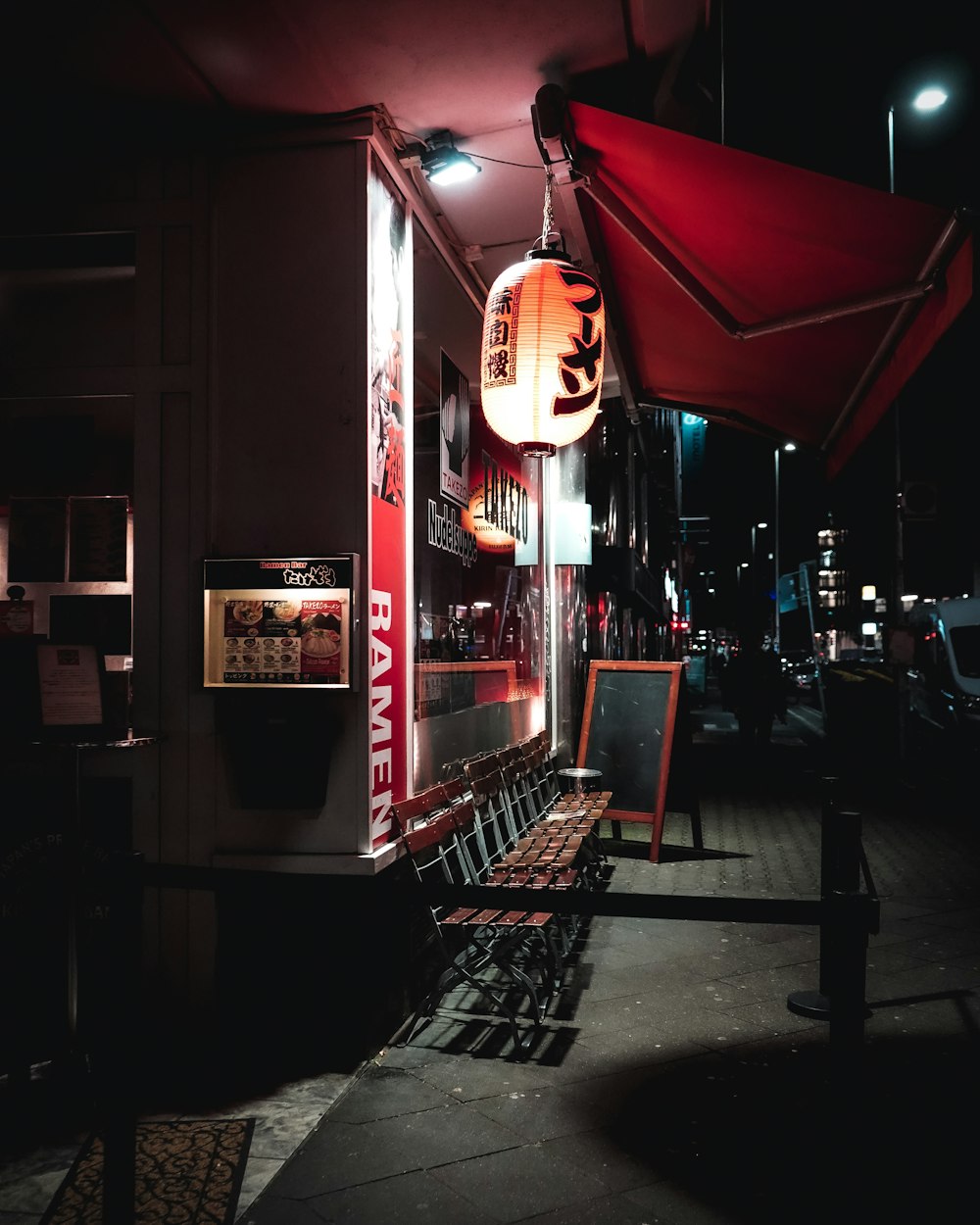 red and black store front during night time