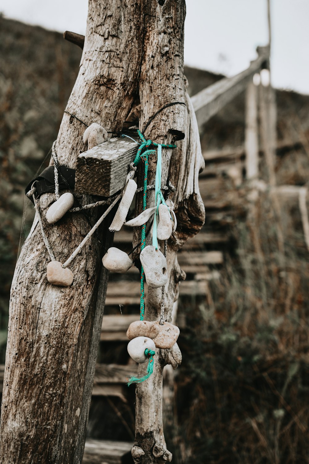 brown wooden hanging decor on brown wooden post