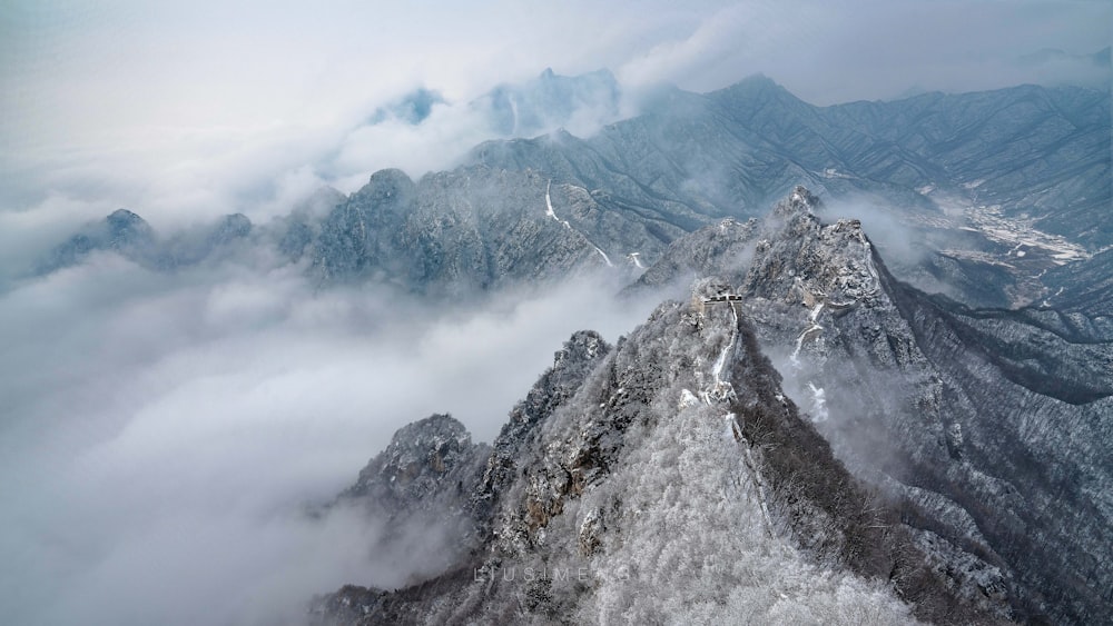 gray and white mountain under white clouds during daytime