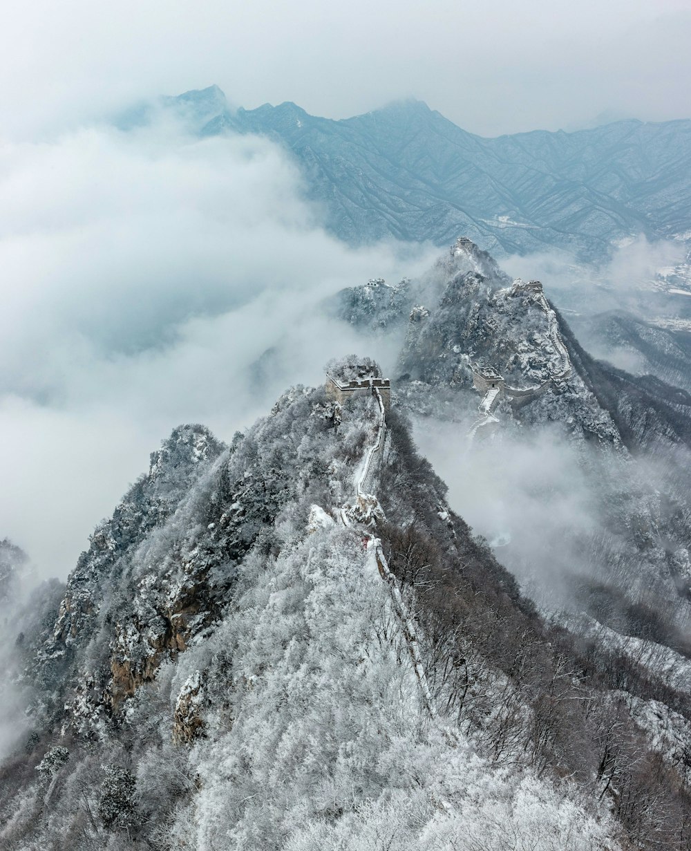 snow covered mountain under cloudy sky during daytime