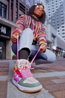 Vibrant street scene with a person wearing bold Kyo sneakers.