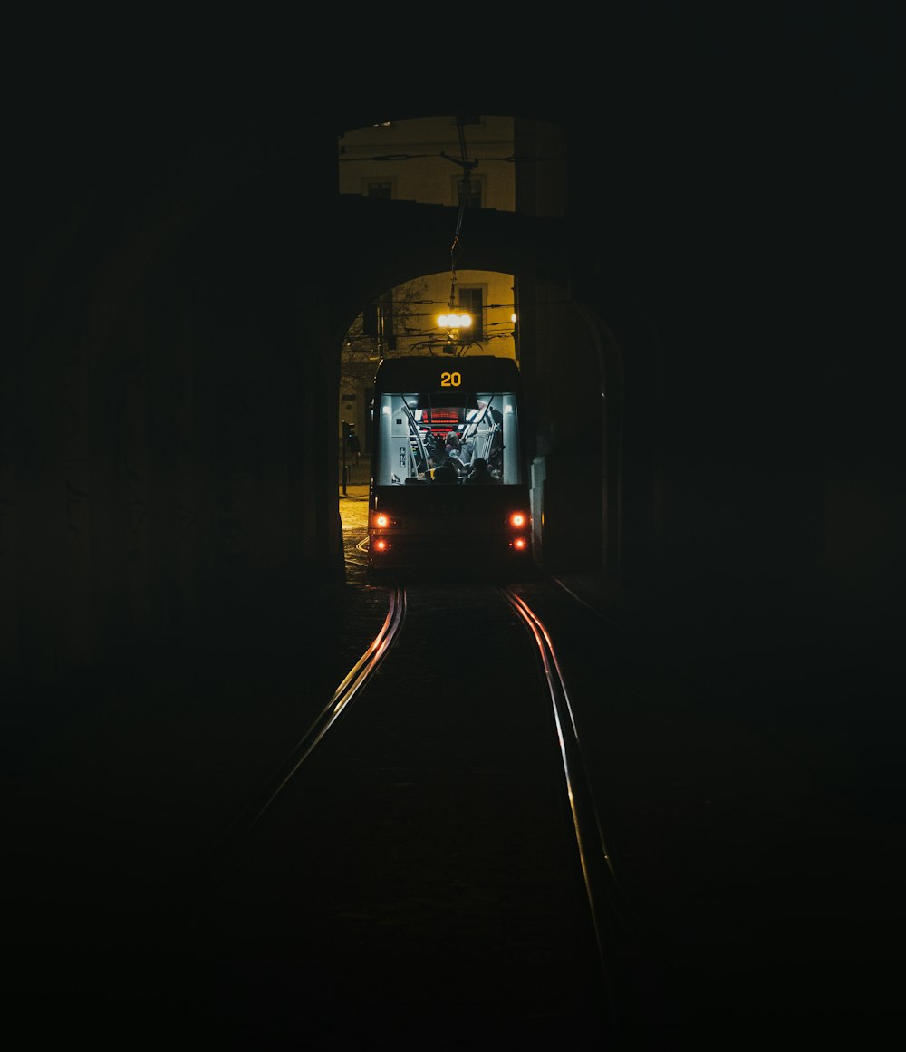 black and blue train in a dark room