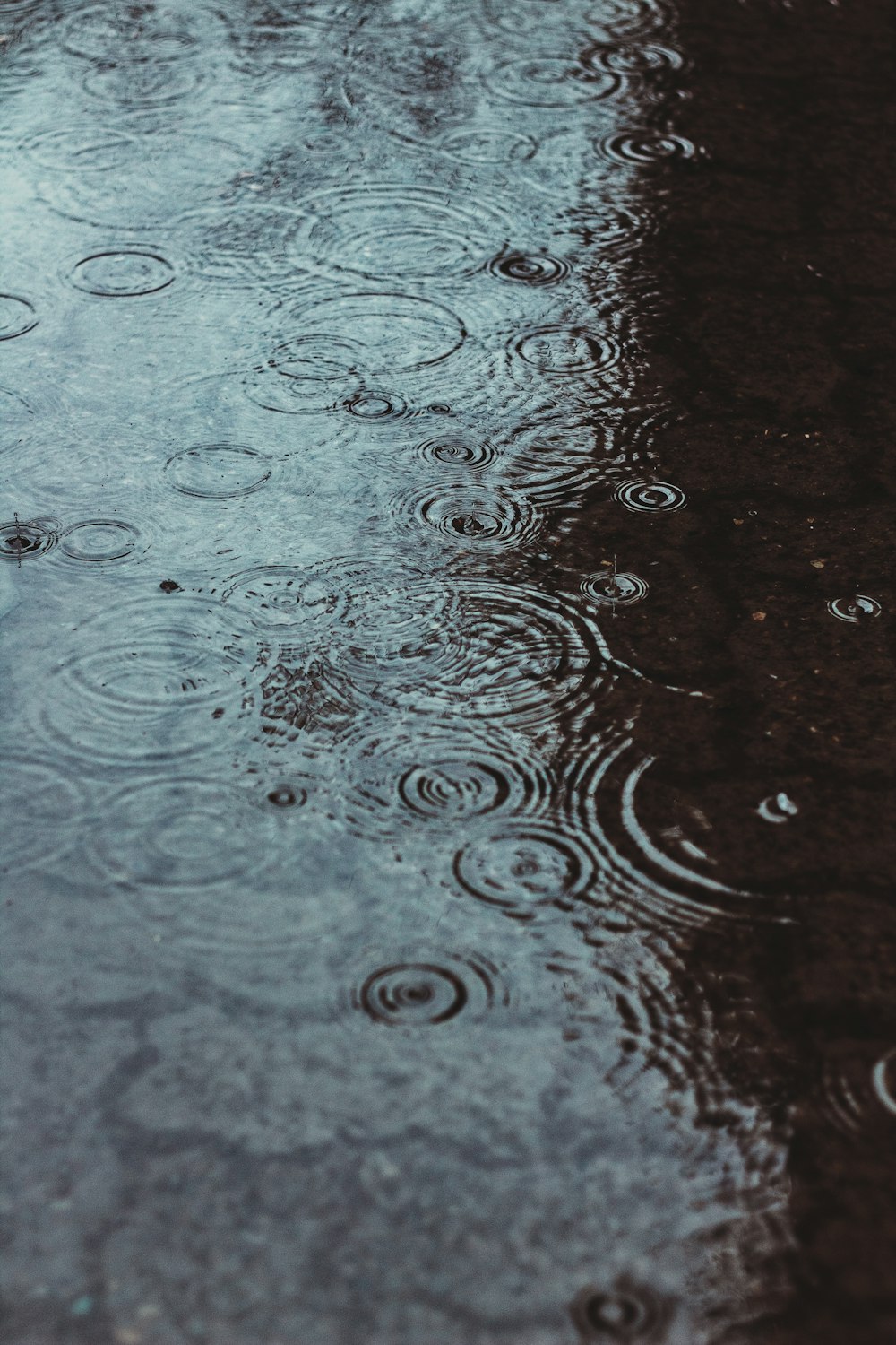 water droplets on brown wooden surface