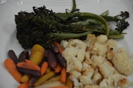 A colorful plate of roasted seasonal vegetables drizzled with balsamic glaze.