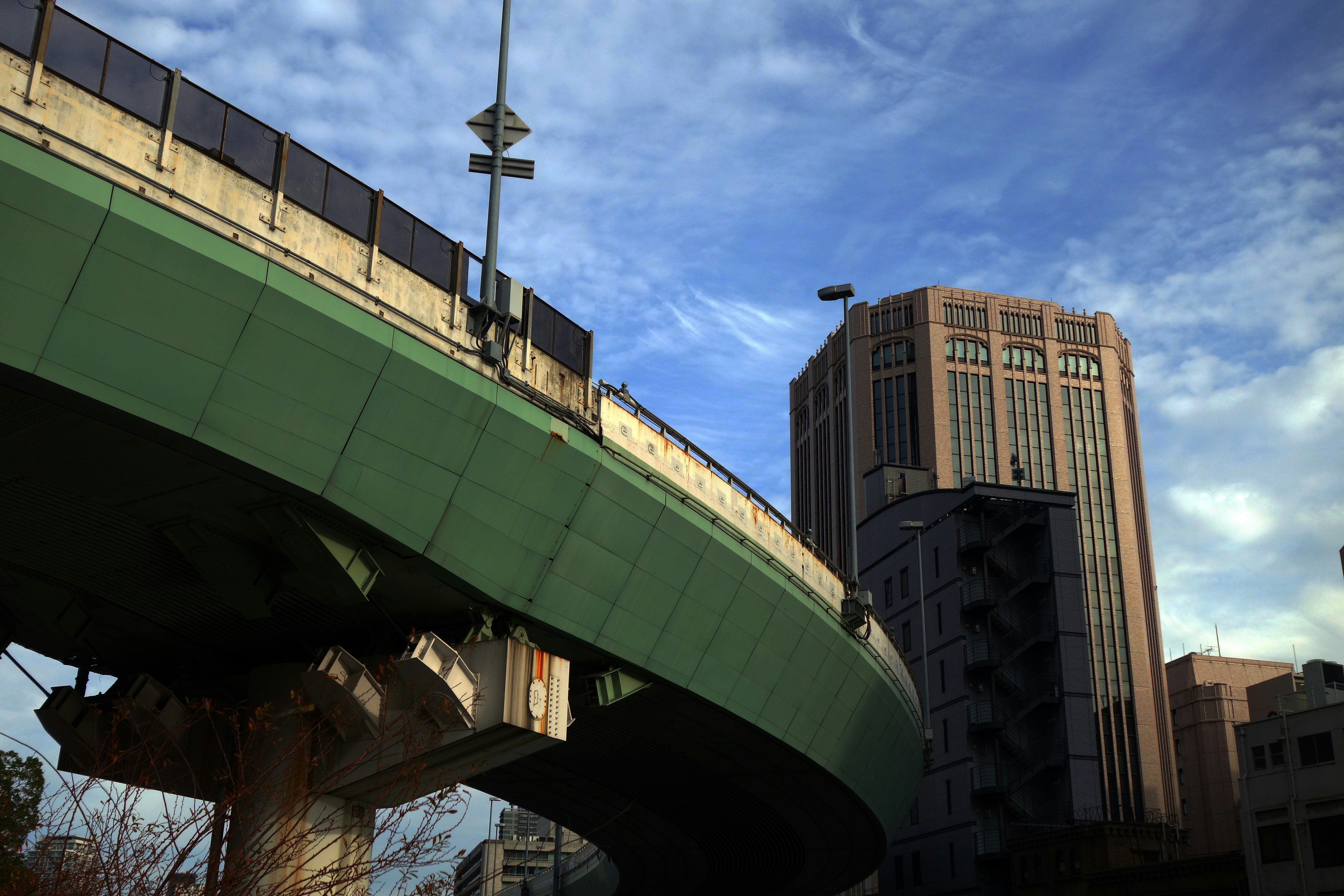 green and white concrete building under blue sky during daytime