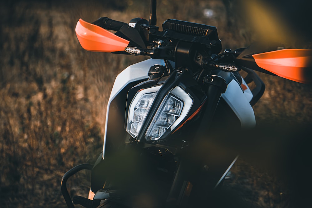 black motorcycle with red and orange umbrella