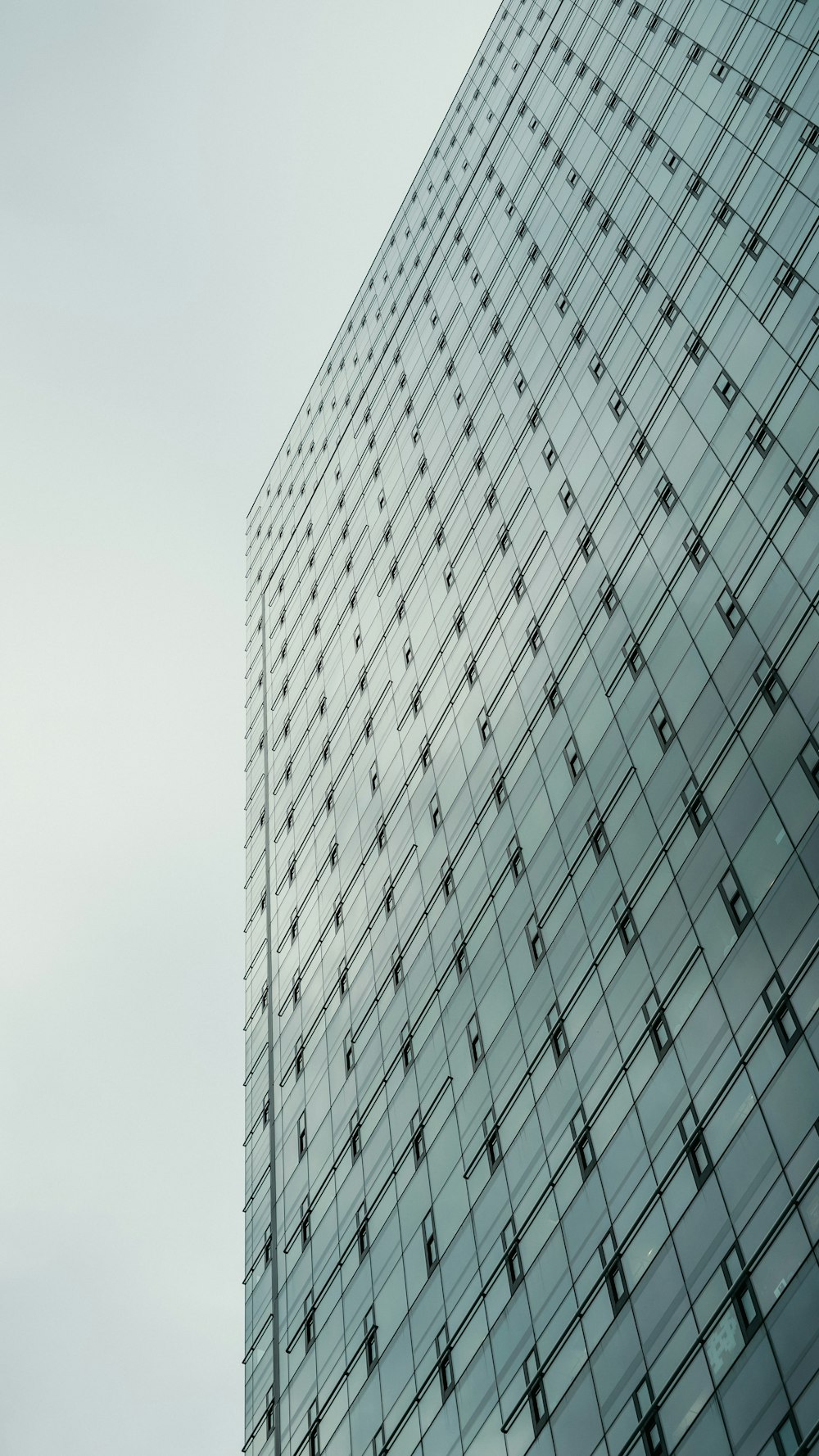 white and black glass walled high rise building