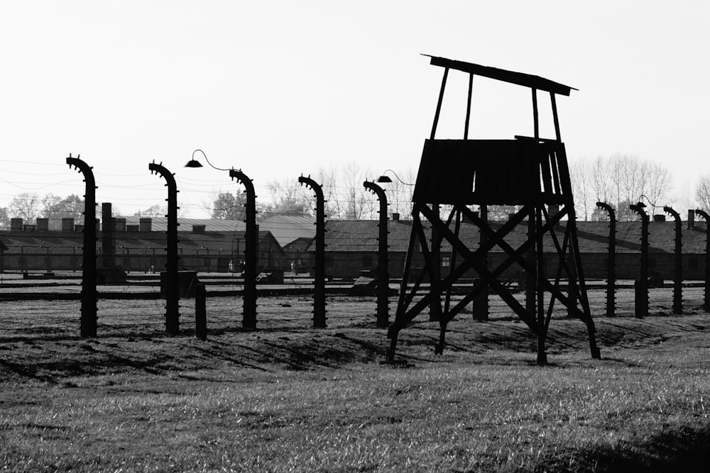 grayscale photo of wooden bridge