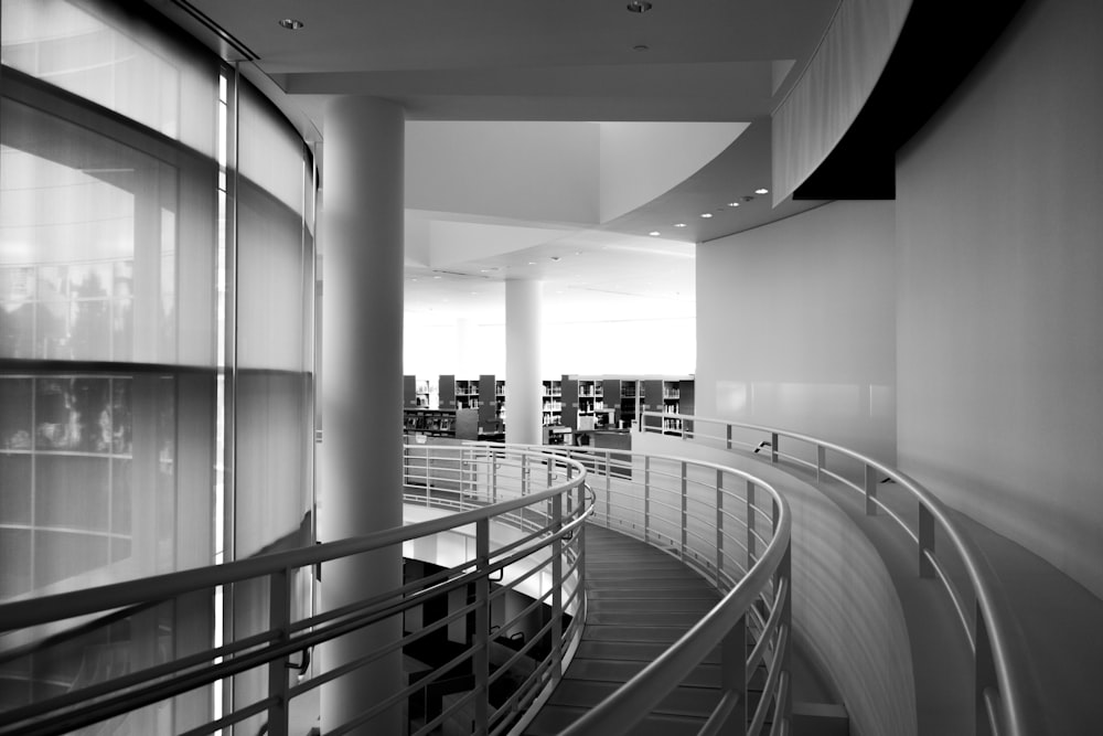grayscale photo of spiral staircase