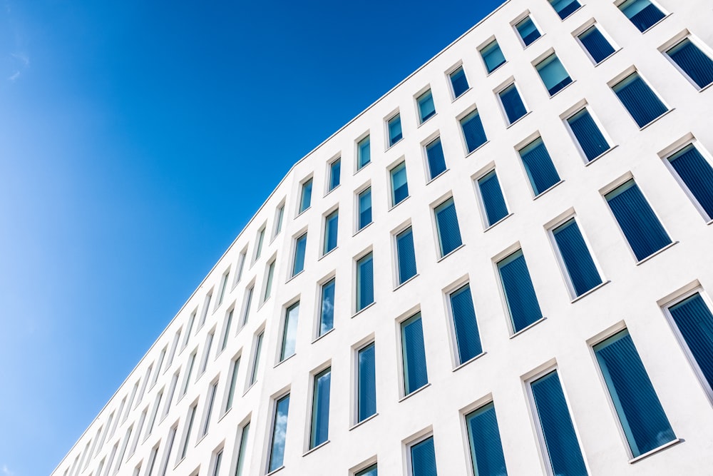 white concrete building under blue sky during daytime