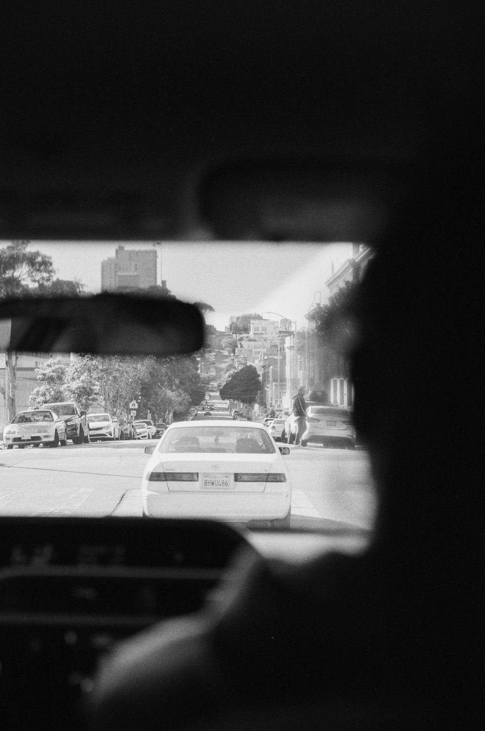 grayscale photo of cars on road