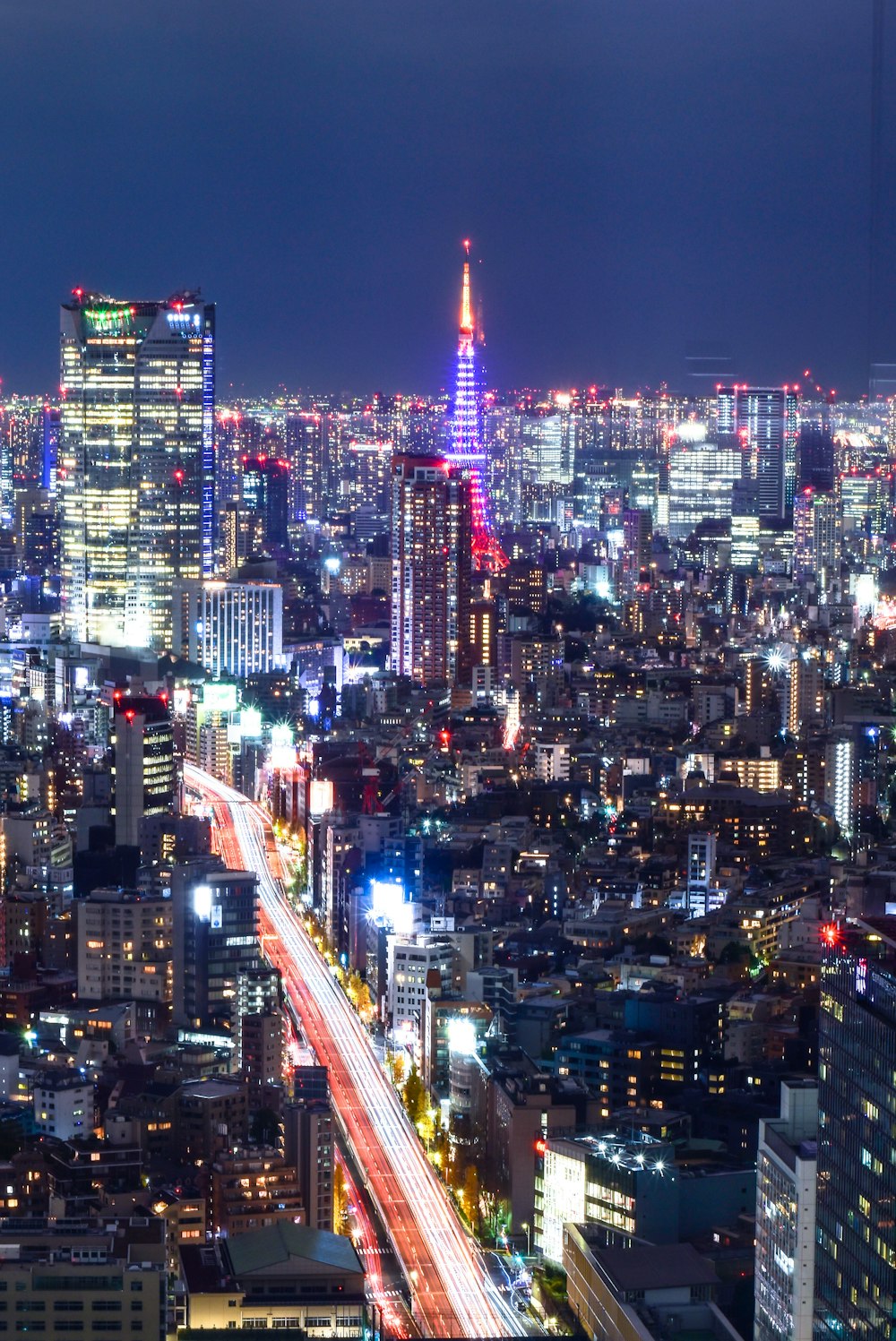 city with high rise buildings during night time