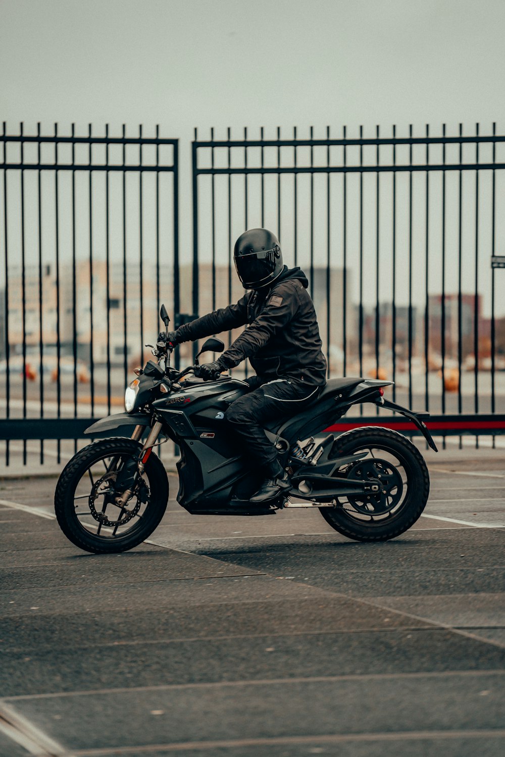 man in black leather jacket riding motorcycle