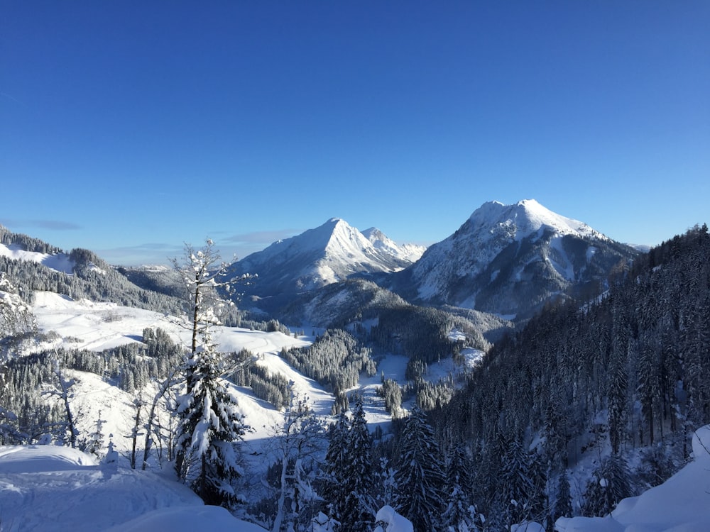 snow covered mountain under blue sky during daytime