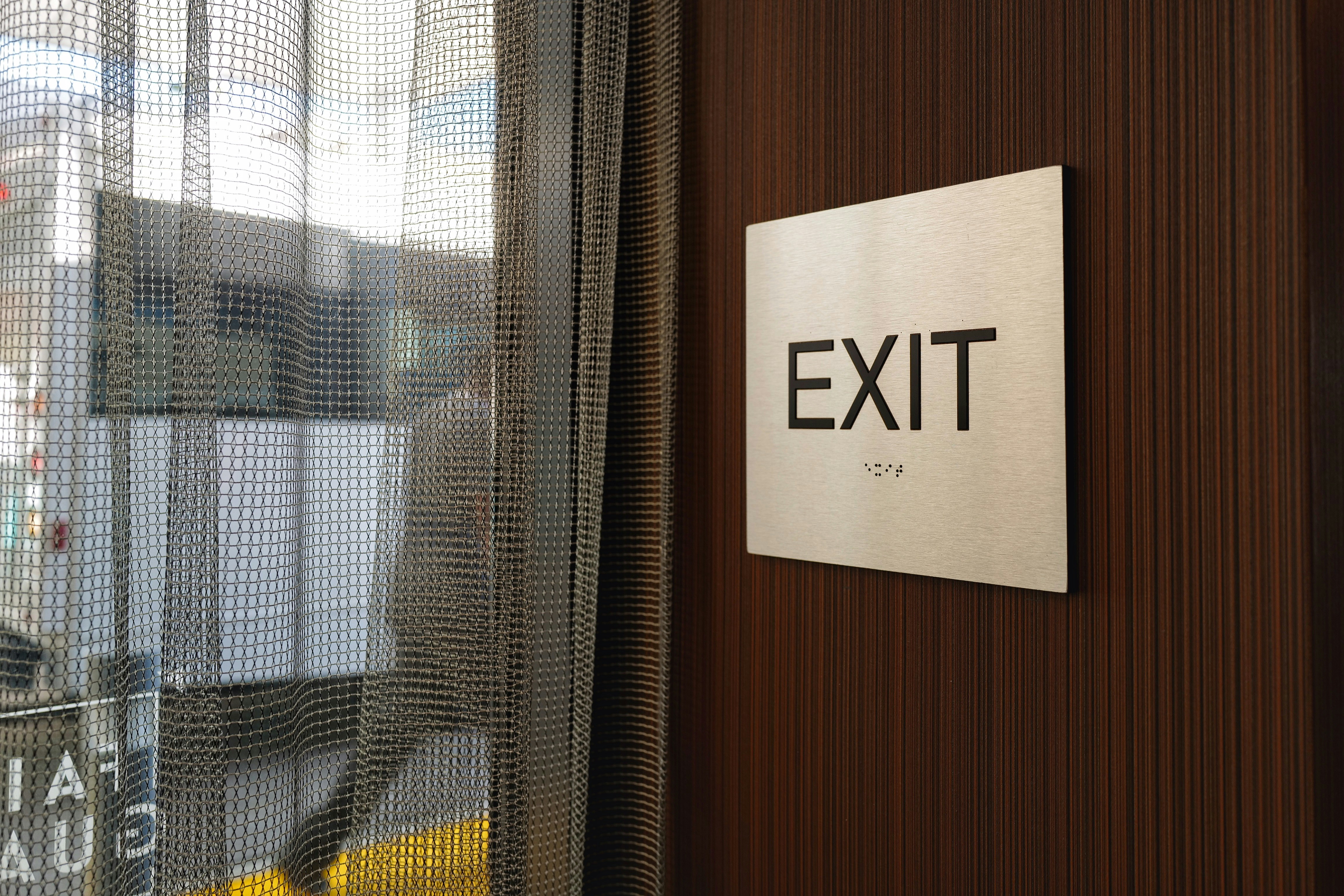 brown wooden door with white window blinds