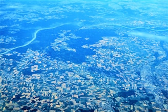 A vibrant collage showing satellite imagery, medical technology, and lush farmland interconnected by digital AI networks.