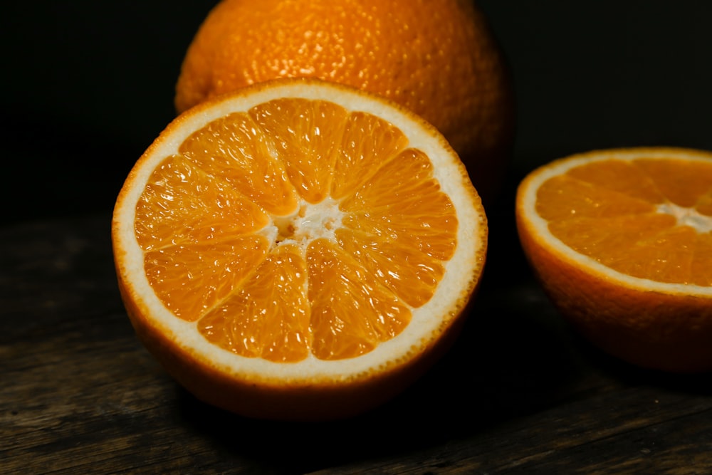 orange fruit on brown wooden table