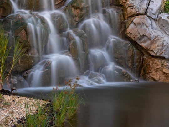 water falls on brown rock in Nanyang Technological University Singapore