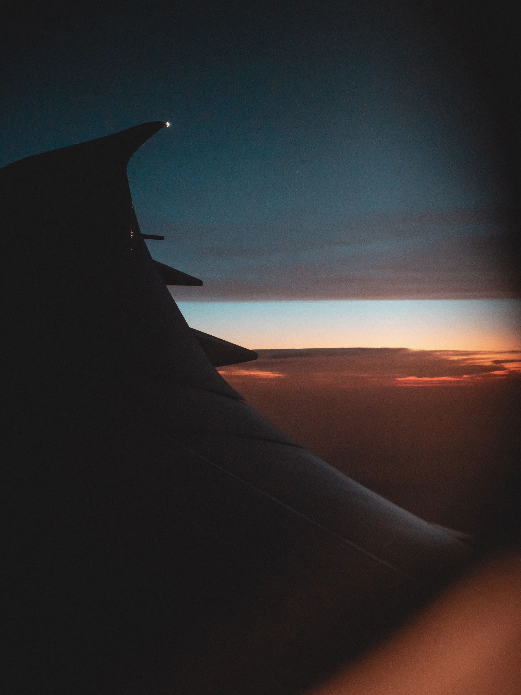 Clouds at sunset seen from an airplane window