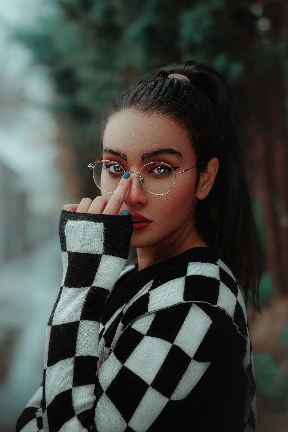 woman in black and white striped long sleeve shirt wearing eyeglasses