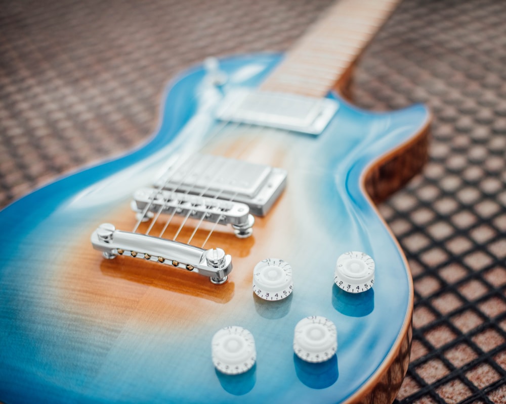 blue and white electric guitar