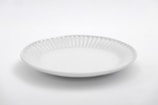 white round plate on white table