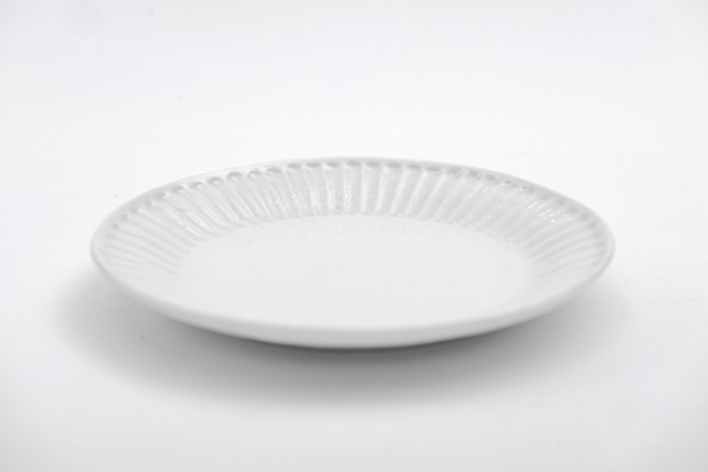 white round plate on white table