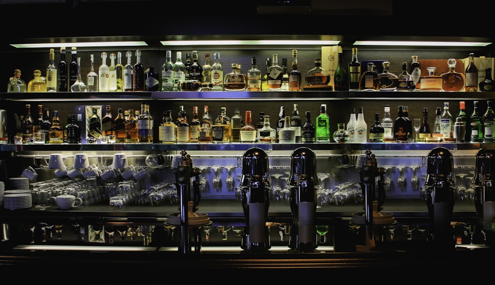 bottles on brown wooden shelf