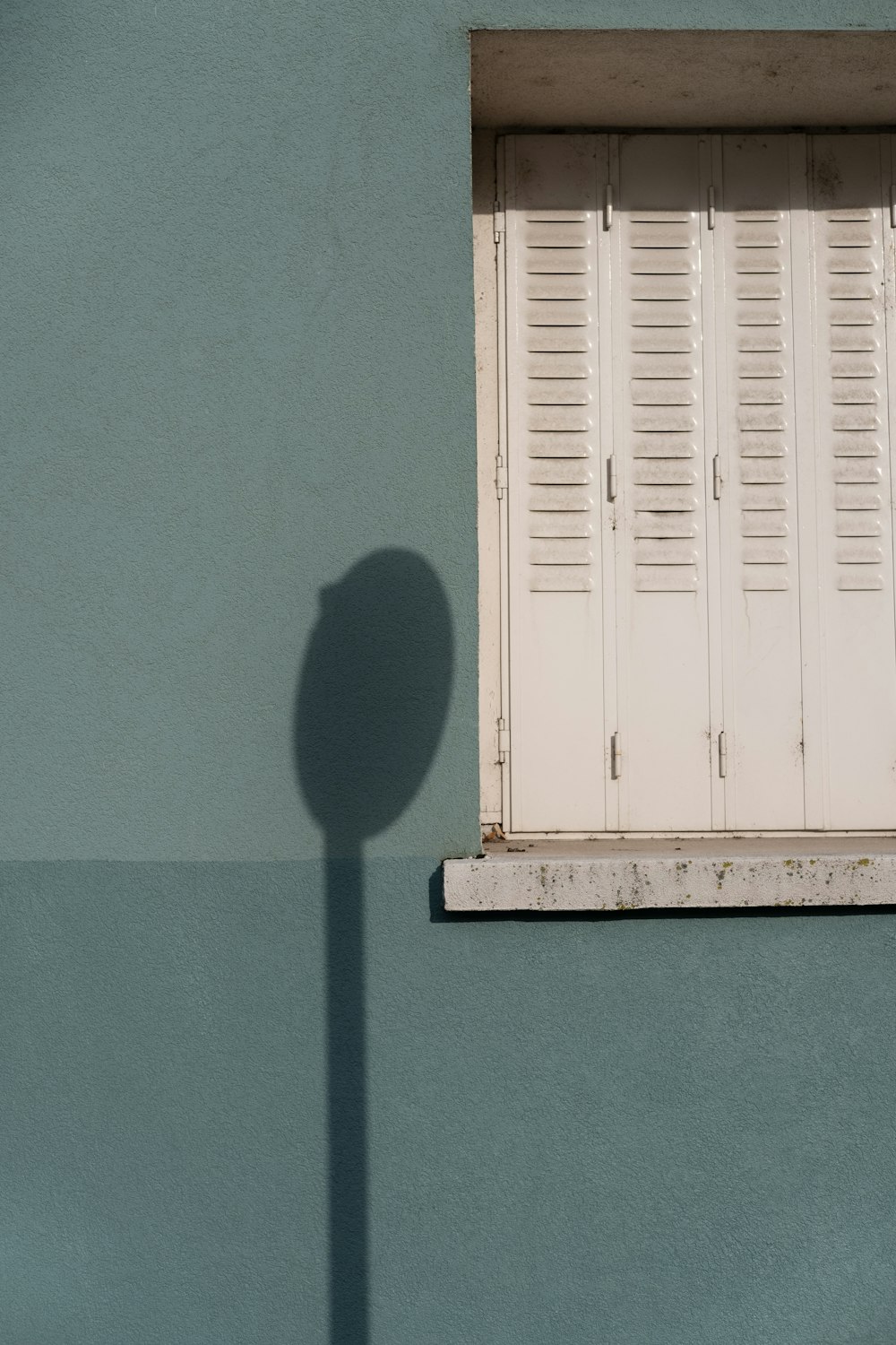 white wooden door on blue painted wall