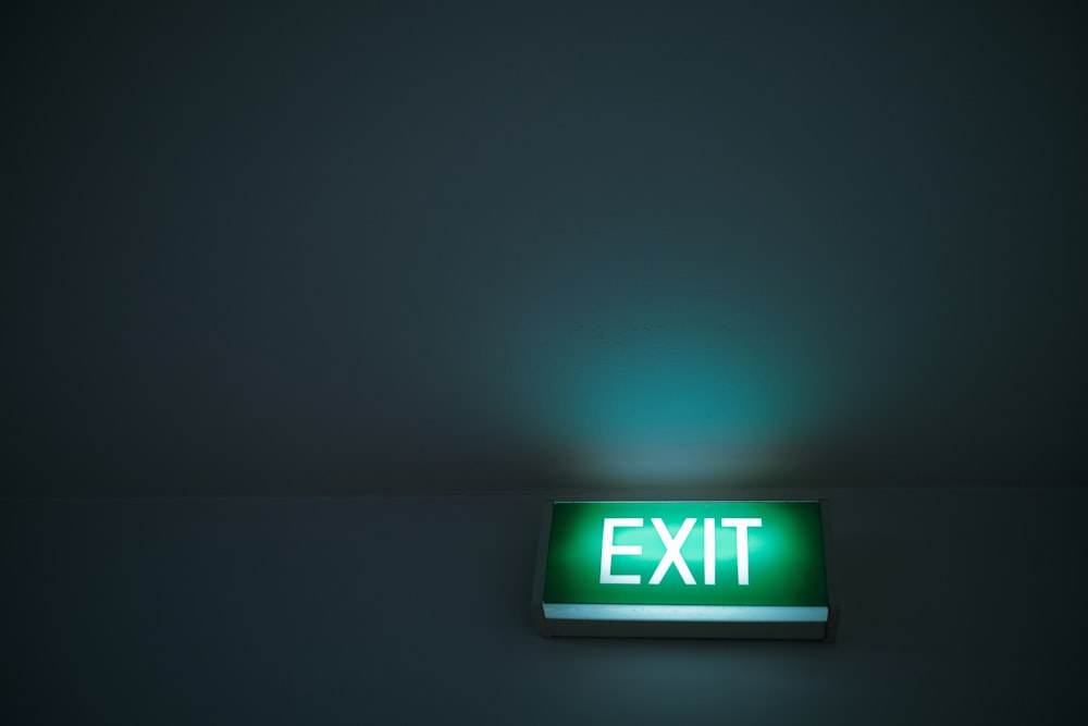 green and white exit sign